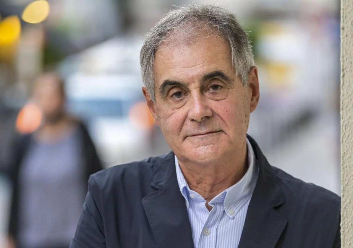 A photo of a man with short gray hair.