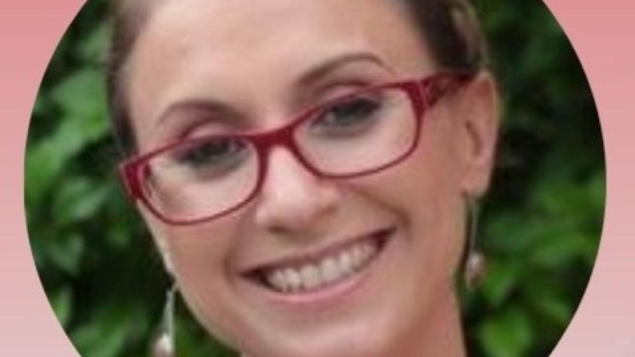 A photo of a woman wearing red glasses