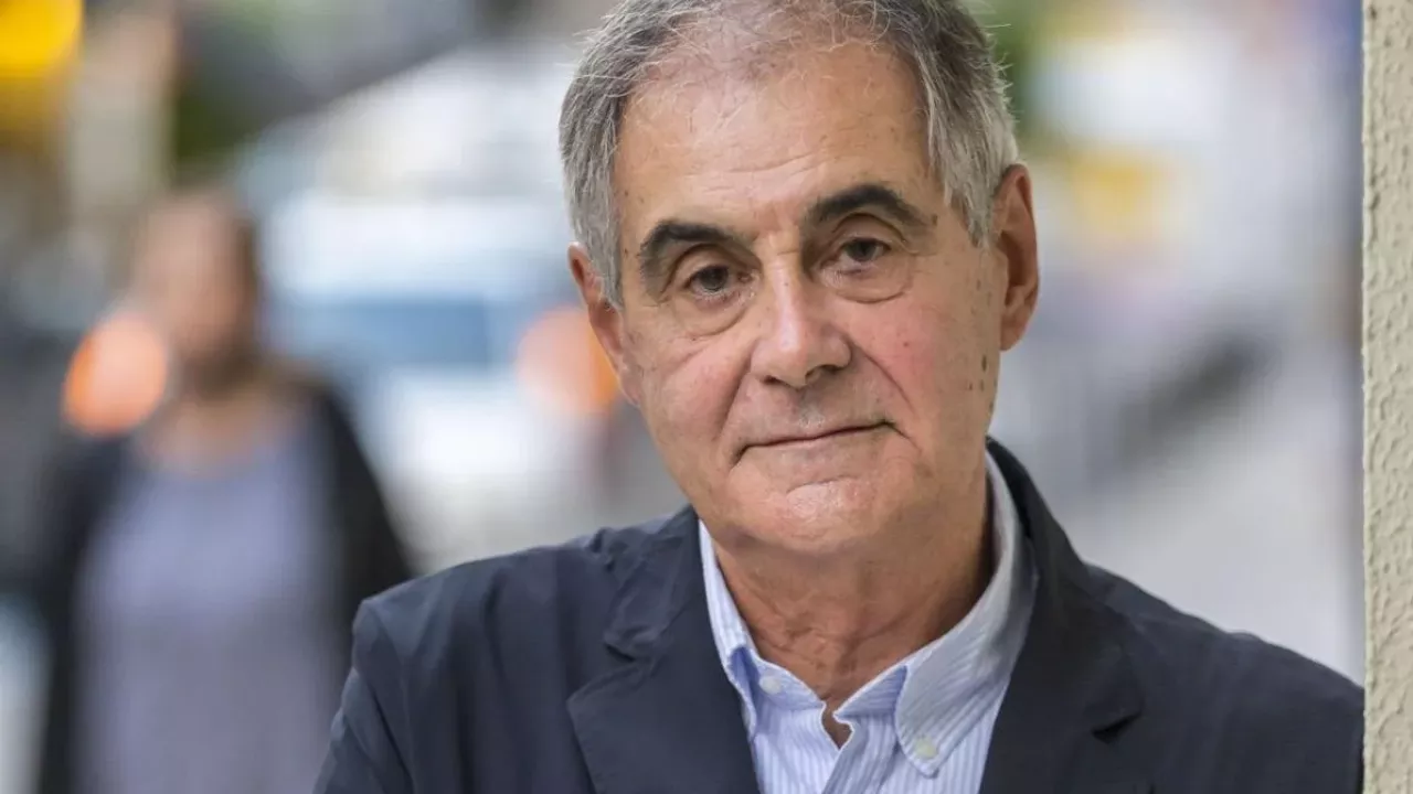 A photo of a man with short gray hair.