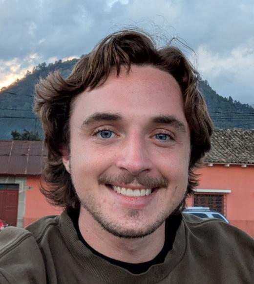 man in front of mountain