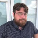 Man sitting in front of window.