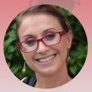 A photo of a woman wearing red glasses