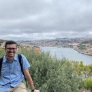 Man with blue shirt in front of river